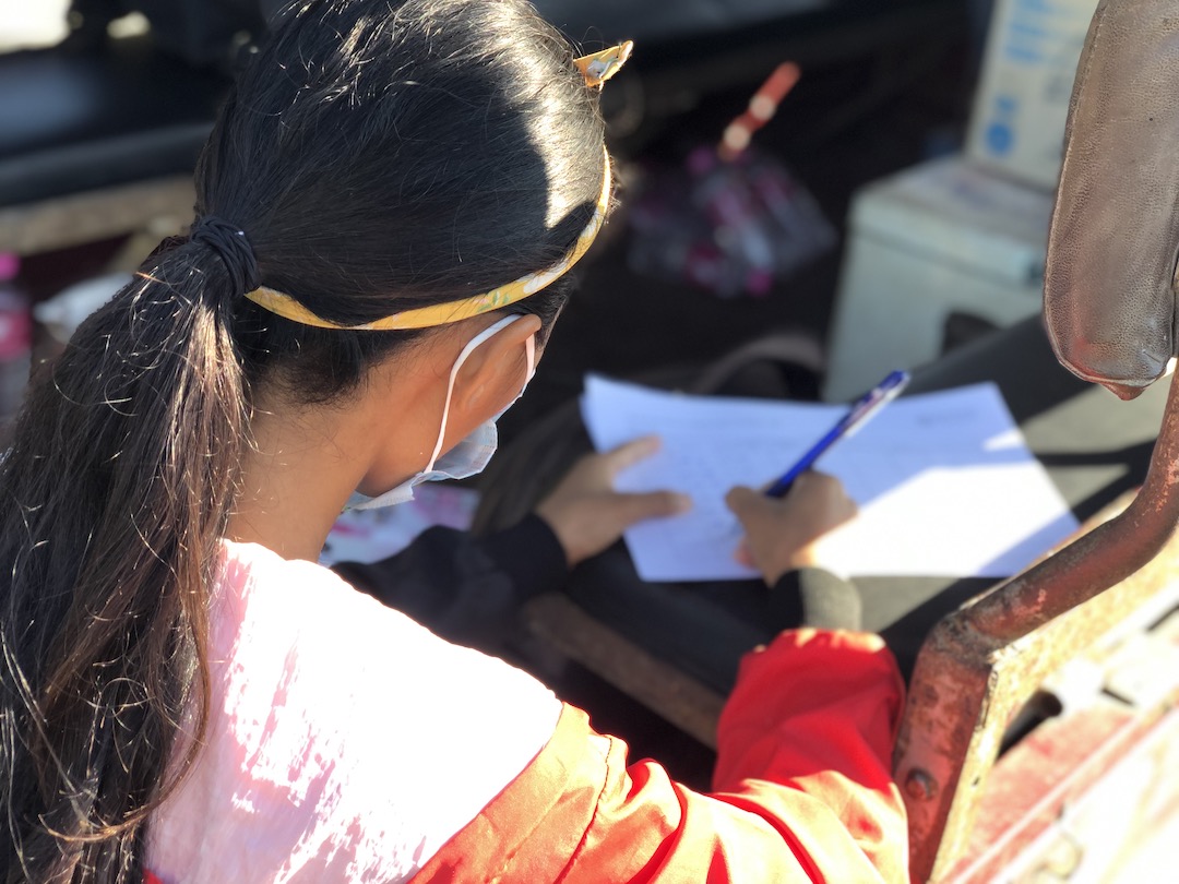 Bopha registers children for the Mobile Library.